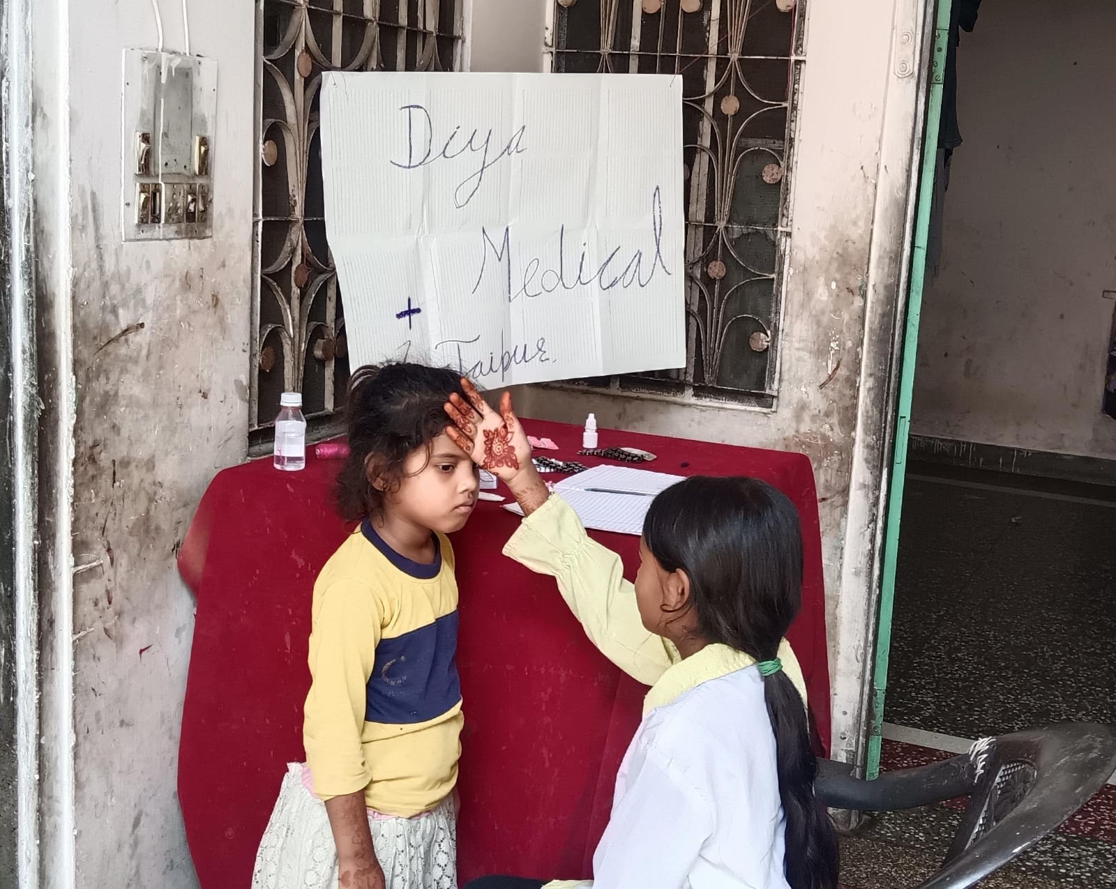 Children taking part in a pretend medical clinic drama activity